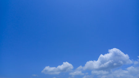 blue clear sky with little white cloudの写真素材