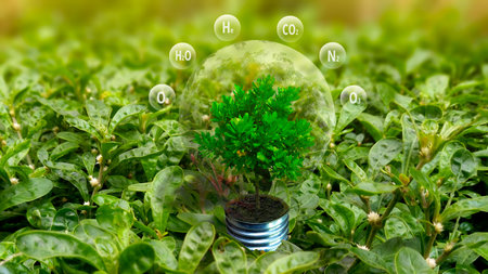 Green eco energy concept. Light bulb with green plant growing inside on green grass.