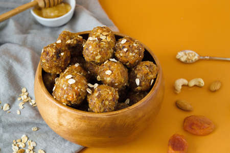 Raw energy balls. Candy vegan balls of dates, raisins, almonds, cashews, dried apricots, oatmeal.の写真素材