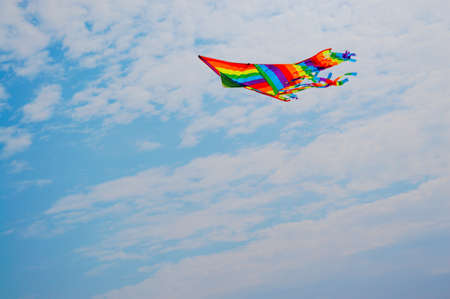 Multicolored kite on a background of sky.の写真素材