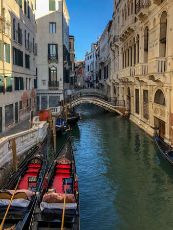 venetian canal and old brick houses in Venice, Italyの写真素材