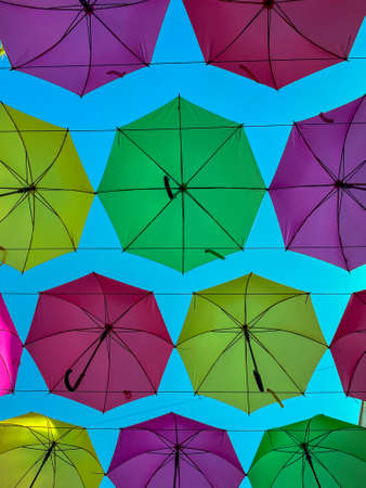 Low Angle View Of Colorful Umbrellas Hanging Outdoors - stock photo. High quality photoの写真素材