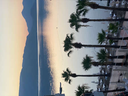 Tourist admiring the sunrise on tropical island - stock photoの写真素材