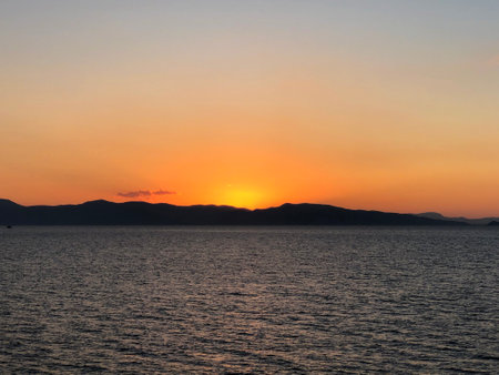 Golden Beautiful sunset at the seaside, Greeceの写真素材