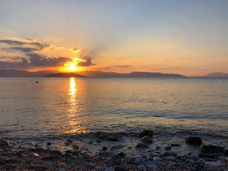 Golden Beautiful sunset at the seaside, Greeceの写真素材