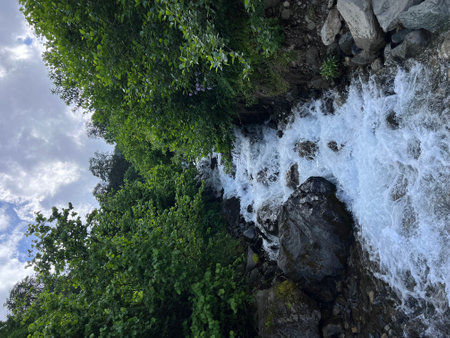 walk in the mountains on a sunny summer day, waterfall. High quality photoの写真素材