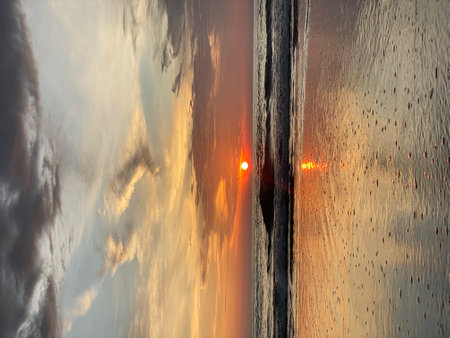 beautiful sunset on Bali. the sky is reflected in the ocean. High quality photoの写真素材