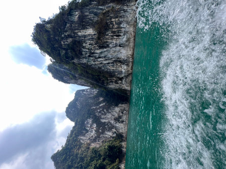 Karst mountains above clear blue water in Khao Sok national park, Cheo Lan lake, Thailand. Beautiful...
