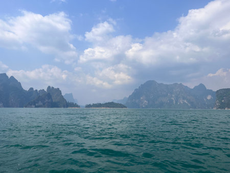 Karst mountains above clear blue water in Khao Sok national park, Cheo Lan lake, Thailand. Beautiful view. High quality photoの写真素材