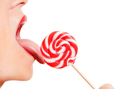 Woman Licking a Lollipopの写真素材