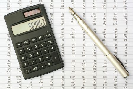 calculator and pen on a white backgroundの写真素材