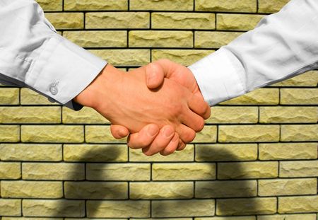 Businessman teamwork partners shaking handsの写真素材