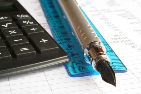calculator and pen on a white background