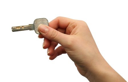 key in hands at a womanの写真素材