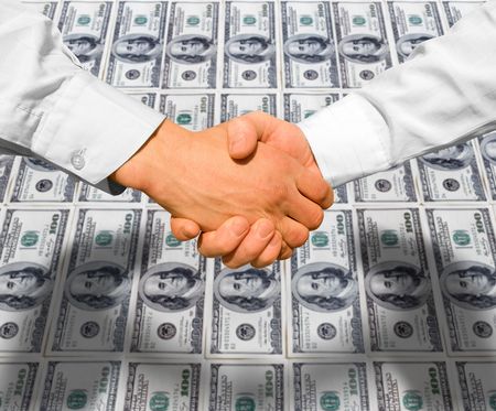 Businessman teamwork partners shaking handsの写真素材