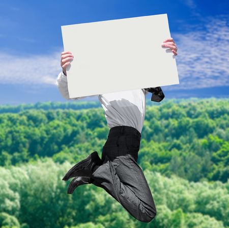 a businessman in air with empty advertisement の写真素材