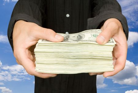 money in a  businessman hand on the whiteの写真素材