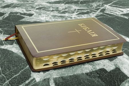 leather Holy Bible on a white background with copy spaceの写真素材