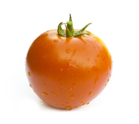 red tomato with drops isolated on white backgroundの写真素材