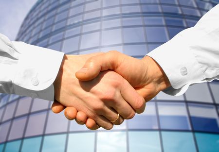 Businessman teamwork partners shaking handsの写真素材