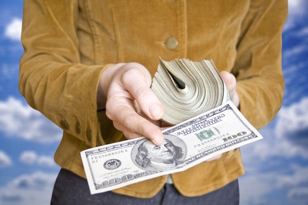 money in a businessman hand on the whiteの写真素材