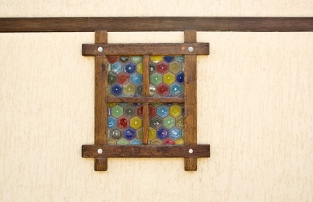 a window against brown wallの写真素材