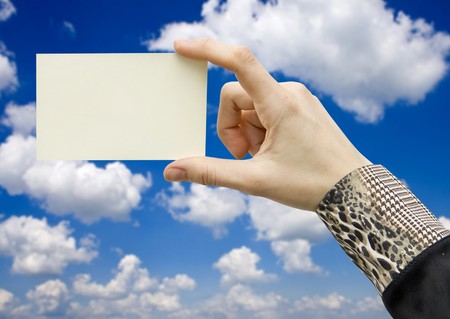 a card blank in a hand on the whiteの写真素材