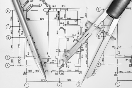 Close up of architect with blueprintsの写真素材