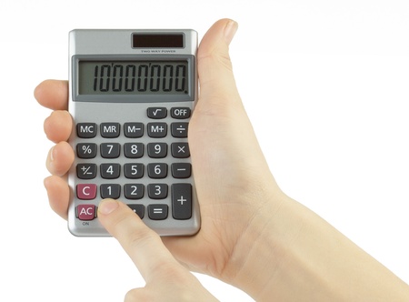 calculator with hand isolated on whiteの写真素材