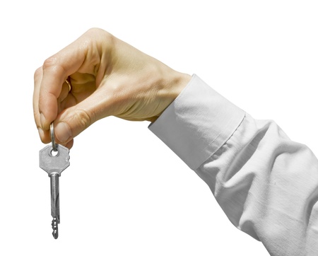 key in a palm over white backgroundの写真素材