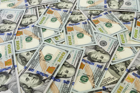 Big pile of money. dollars over white background