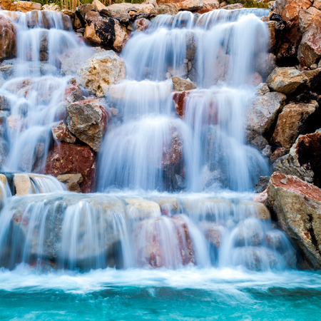waterfall beautiful background of stone, water, moss.の写真素材