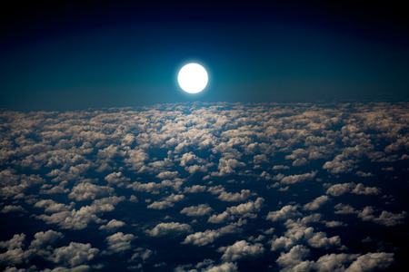 plane flies on the sky and the sun backgroundsの写真素材