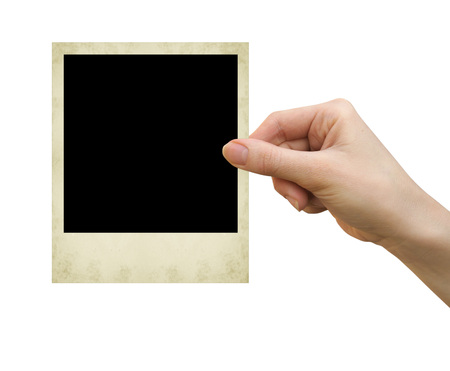 polaroid card blank in a hand on the white
