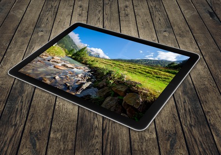 tablet on the wood backgroundsの写真素材