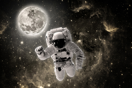 astronaut flies over the earth in space.の写真素材