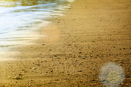 Stones on a background of blurred sea with mountain views 
