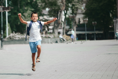 the boy runs to schoolの写真素材