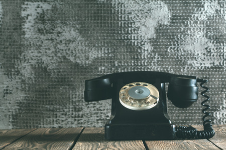 a old phone on the woodの写真素材