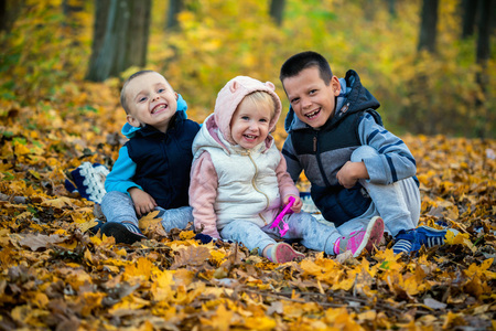 a children in the autumn forest