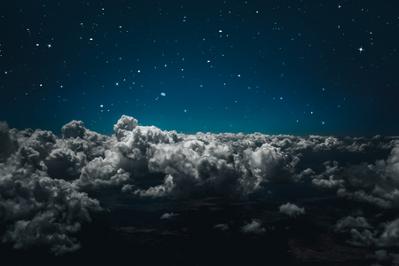 backgrounds night sky with stars and moon and cloudsの写真素材