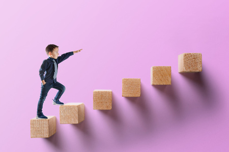 growth business concept. young businessman climbing the career ladderの写真素材