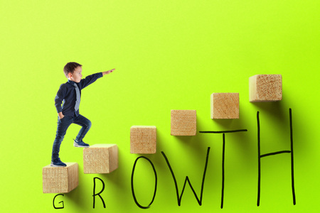 growth business concept. young businessman climbing the career ladderの写真素材
