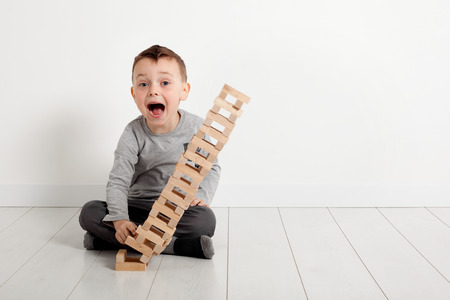 boy playing with a block at homeの写真素材
