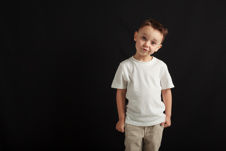 model boy posing on gray backgroundの写真素材
