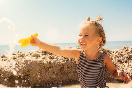 Child playing on the seashoreの写真素材