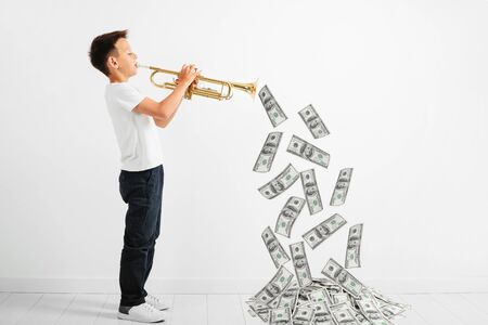child playing trumpet on white background