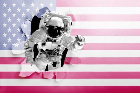 astronaut flies over the earth in space.の写真素材