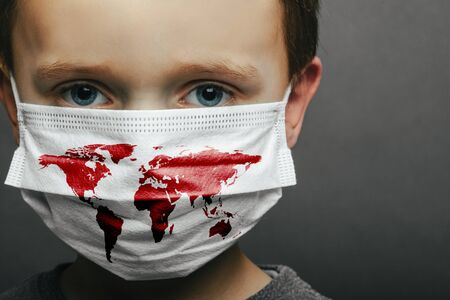 Face of a mask-wearing boy with fear in the eye Close-up on a gray background.
Coronavirus and Air pollution pm2.5 conceptの写真素材