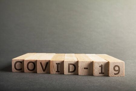 Coronavirus COVID-19 inscription on wooden blocks
 pm2.5 concept. の写真素材